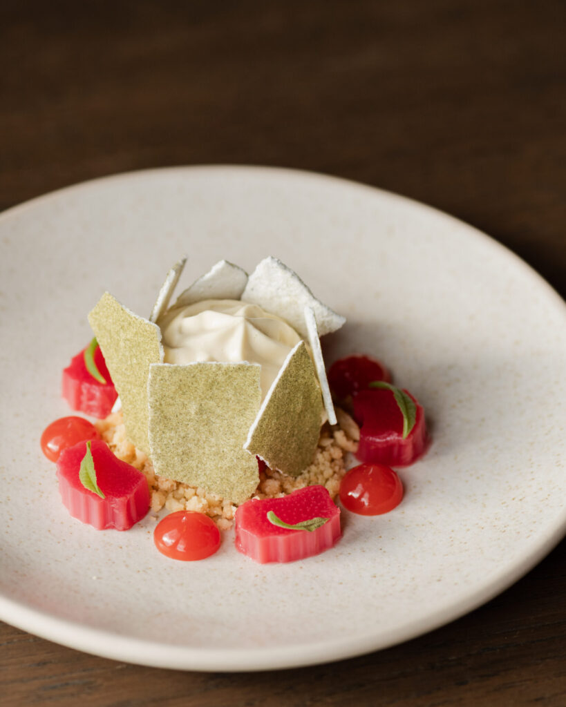 Tomlinson Yorkshire rhubarb sits at the centre of this dessert, poached lightly, sharpened with blood orange, lemon verbena, and finished with crisp meringue.